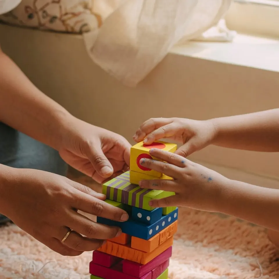 A child stacking colorful blocks during play — Liftoff ABA in Edison